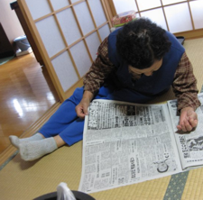 Grandma, 82, reading the paper